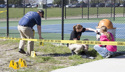 Students conducting a faux investigation