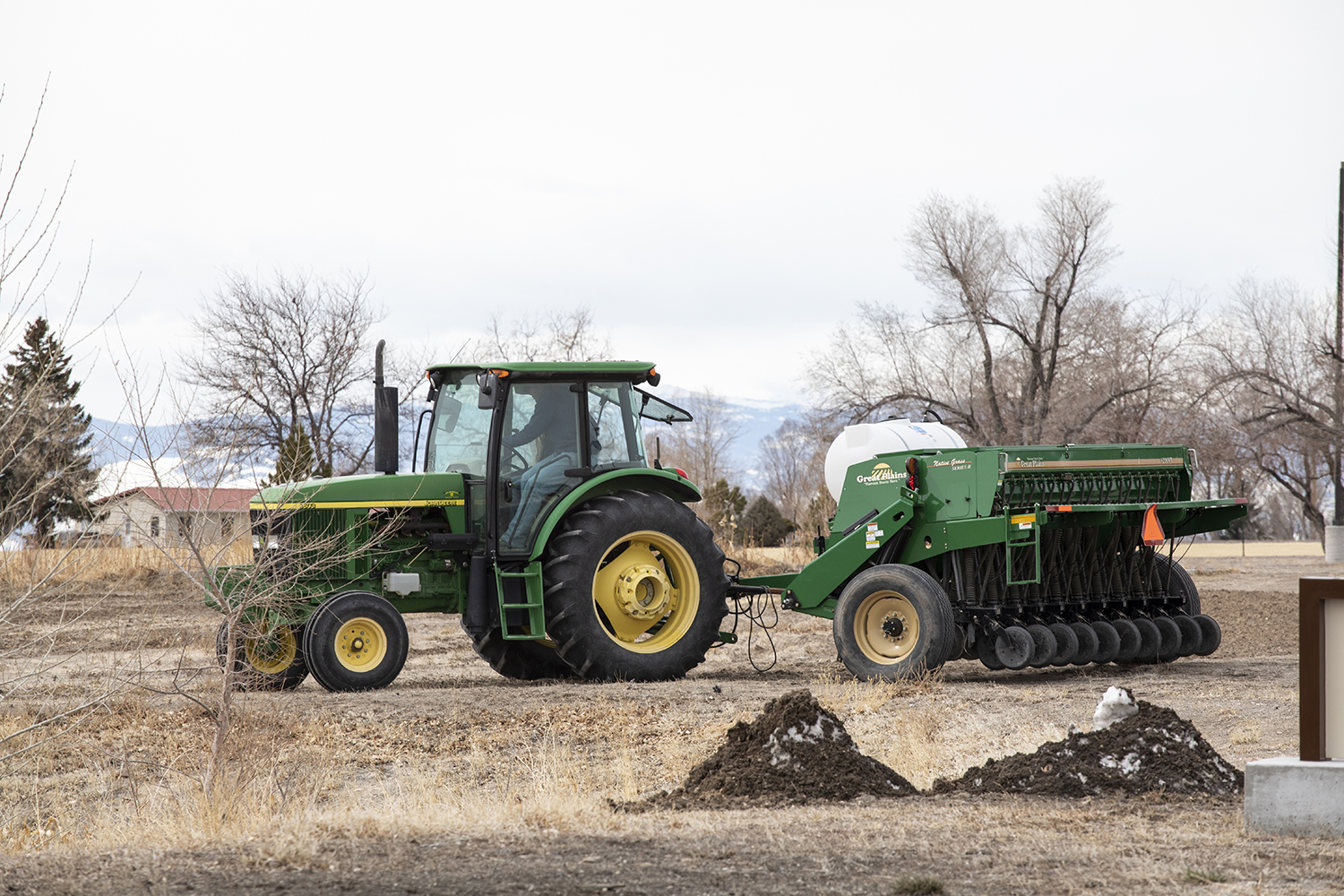 John Deere tractor planting crops