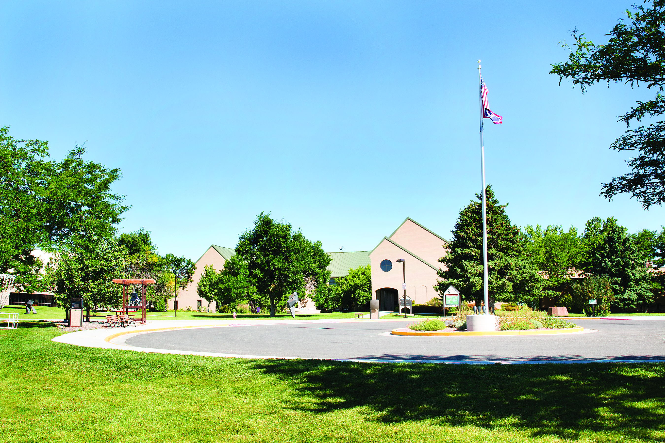 Main Building, flag pole, and trees at CWC