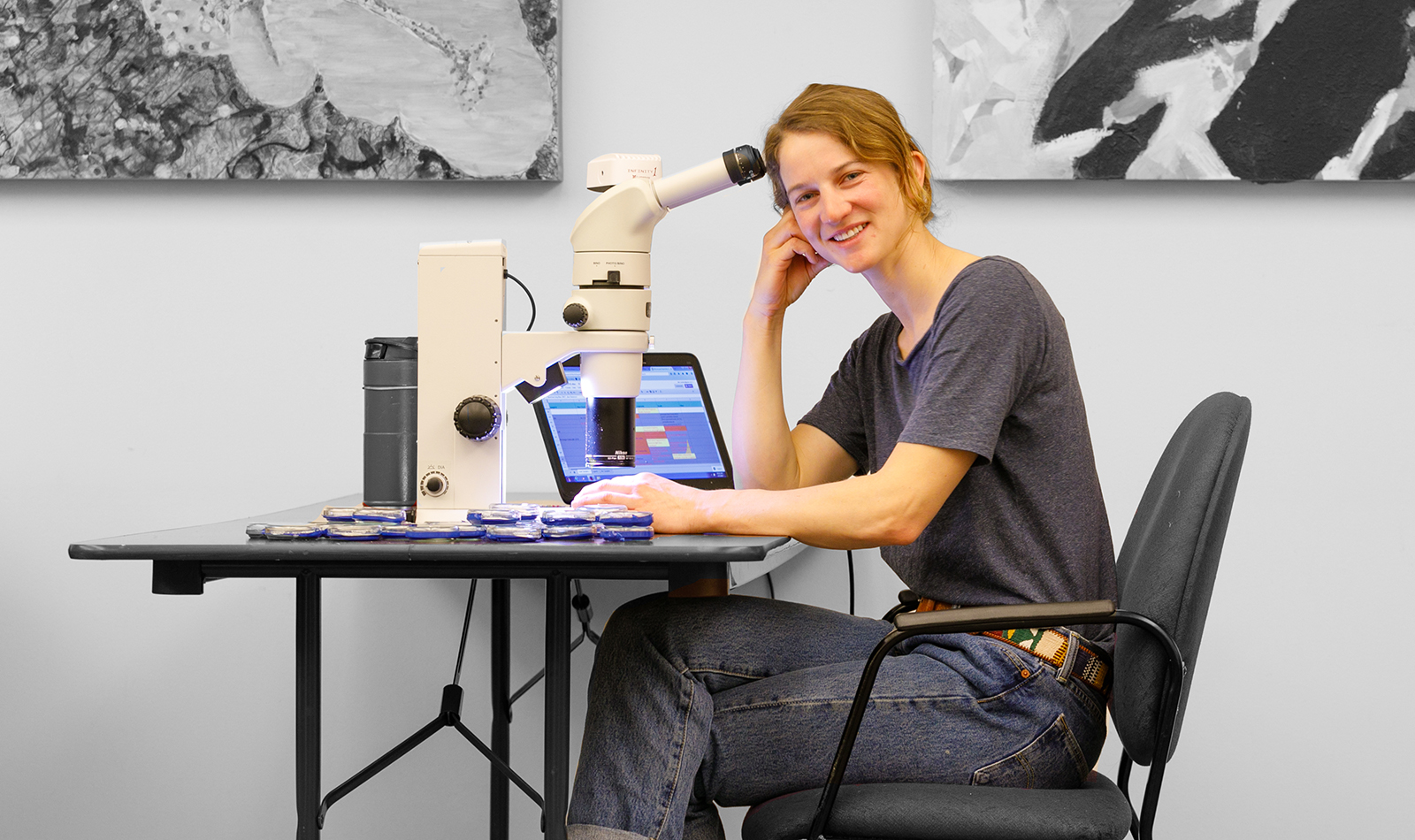 photo of CWC student Ellen Yeatman with a microscope