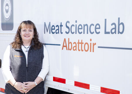 Amanda Winchester standing next to meat science abattoir
