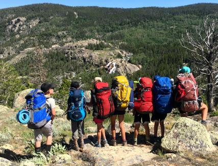 Young students backpacking in Sinks Canyon Wyoming