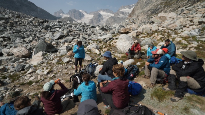 CWC Students Attend Class on Ice-Mass Balance at the Terminal Moraine of the Dinwoody Glacier. (Visiting Scholar Sarah Konrad from the University of Wyoming delivers the briefing.) Photo by Kyle Nicholoff
